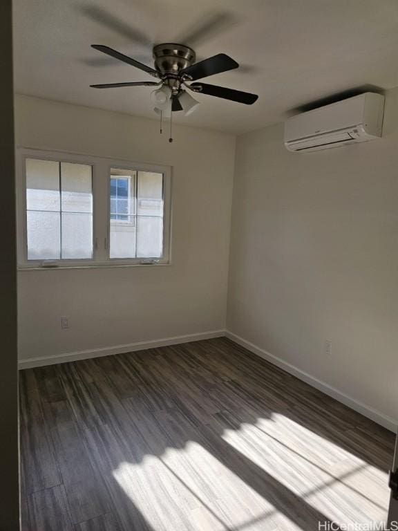 unfurnished room with a wall mounted air conditioner, ceiling fan, and dark wood-type flooring