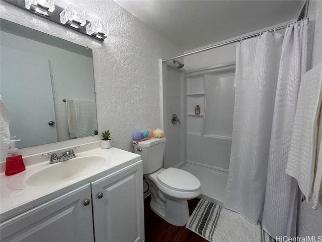 bathroom featuring a shower with curtain, vanity, toilet, and wood-type flooring