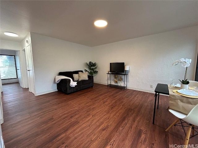 sitting room featuring dark wood-type flooring