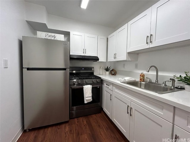 kitchen with sink, white cabinets, stainless steel appliances, and dark hardwood / wood-style floors