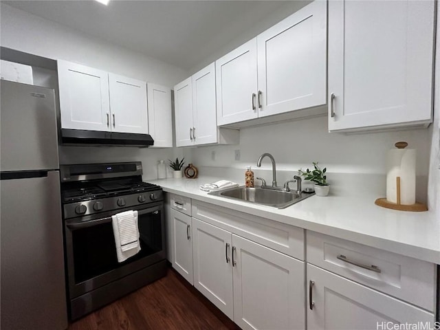 kitchen featuring white cabinets, dark hardwood / wood-style floors, sink, and appliances with stainless steel finishes