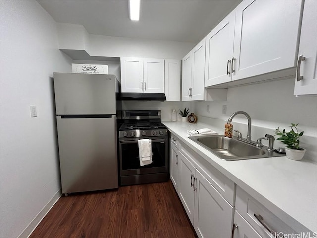 kitchen featuring white cabinetry, sink, dark wood-type flooring, and appliances with stainless steel finishes