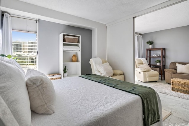 bedroom featuring a textured ceiling