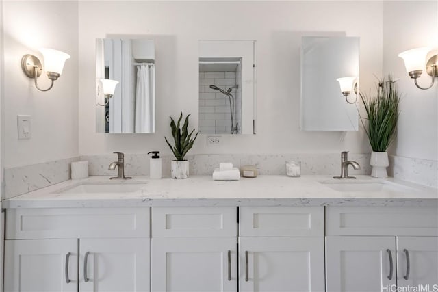 bathroom featuring walk in shower and vanity