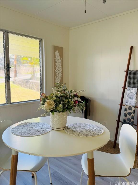 dining area with wood finished floors