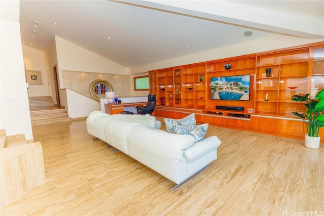 living room featuring light hardwood / wood-style floors and lofted ceiling