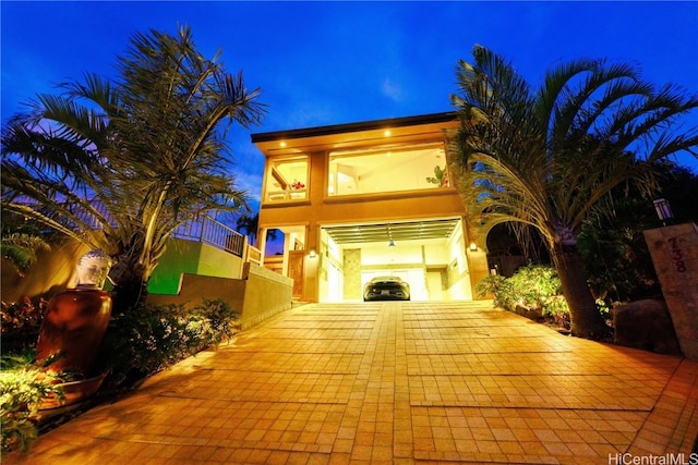 view of front of house with a balcony and a garage