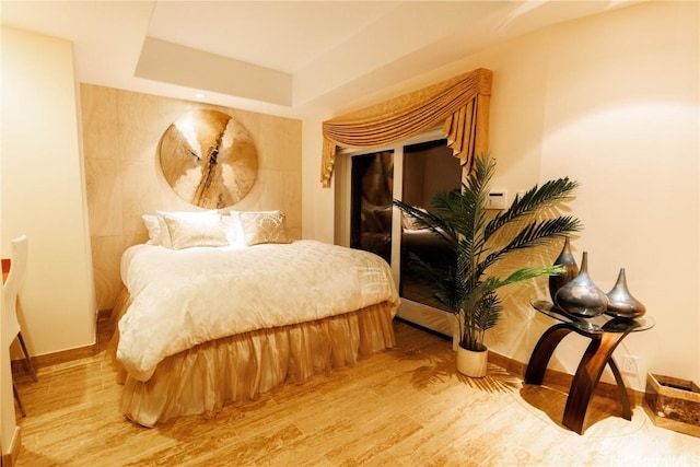 bedroom with hardwood / wood-style flooring