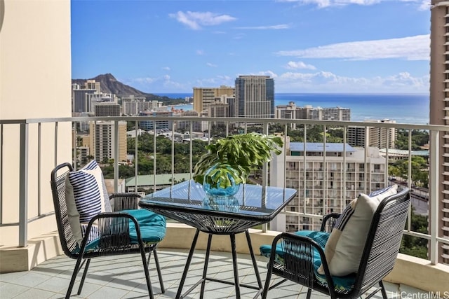 balcony featuring a water view