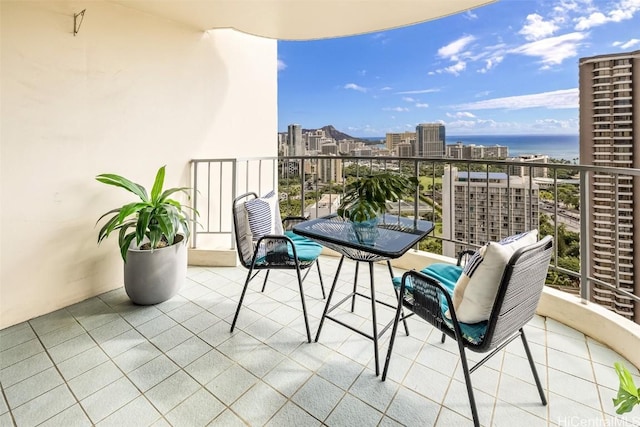 balcony featuring a water view