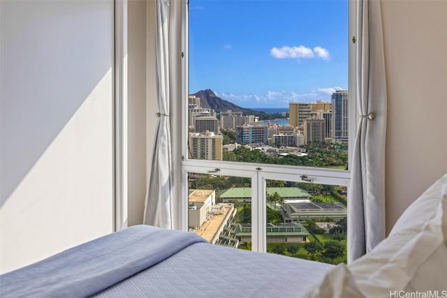 bedroom featuring a mountain view