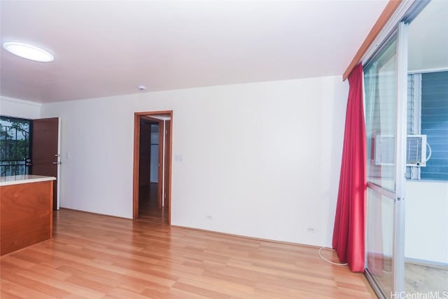 spare room with light hardwood / wood-style floors