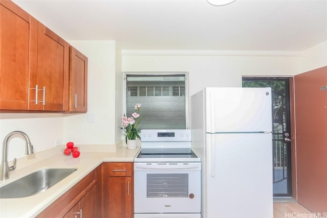 kitchen featuring white appliances and sink