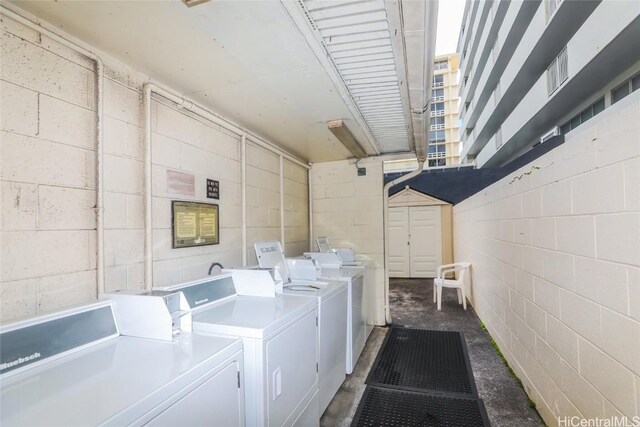 clothes washing area featuring washing machine and clothes dryer