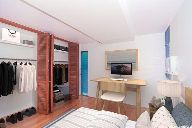 bedroom featuring a closet and light hardwood / wood-style floors