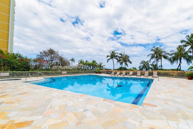 view of swimming pool featuring a patio