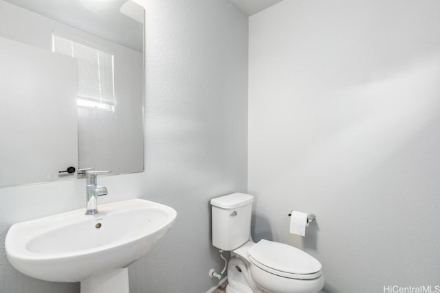 bathroom with sink and toilet