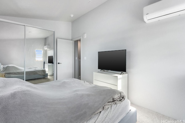 bedroom featuring carpet flooring, lofted ceiling, a closet, and a wall mounted air conditioner