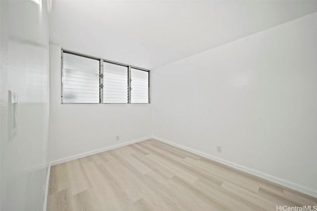 spare room featuring light hardwood / wood-style floors