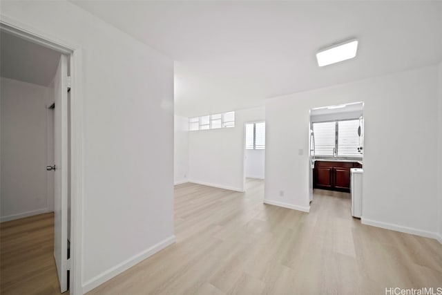 spare room with light hardwood / wood-style flooring