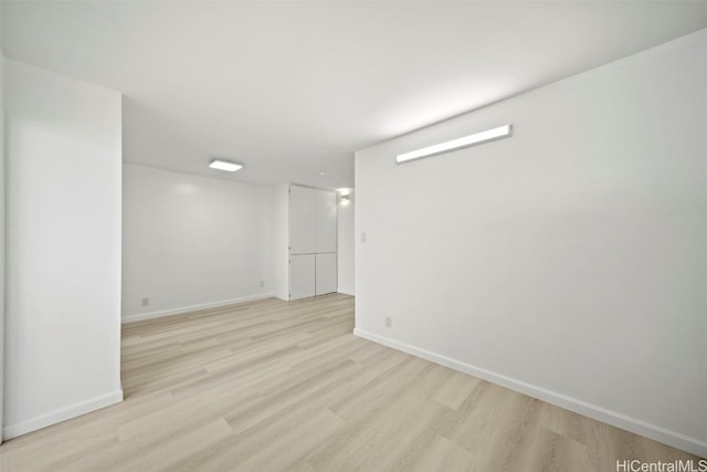 empty room with light hardwood / wood-style flooring