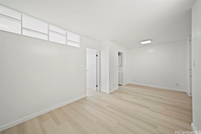 empty room with light hardwood / wood-style floors