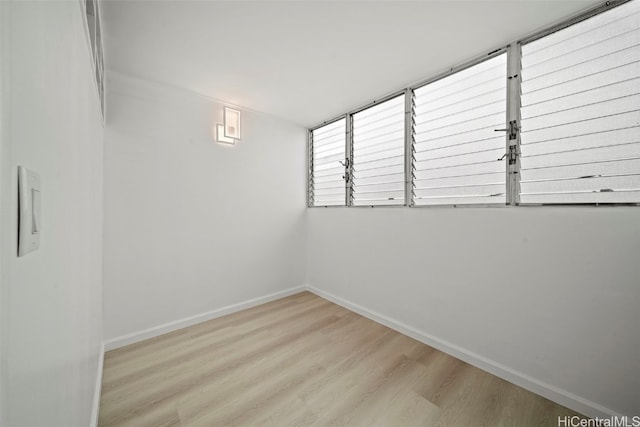 basement featuring light hardwood / wood-style flooring