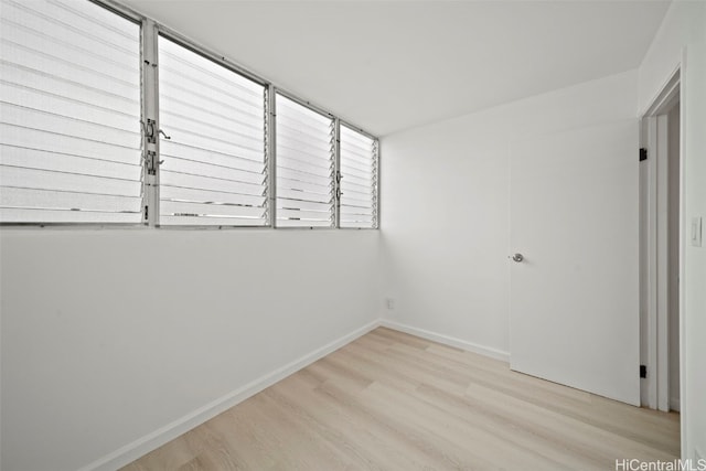 spare room with light hardwood / wood-style flooring