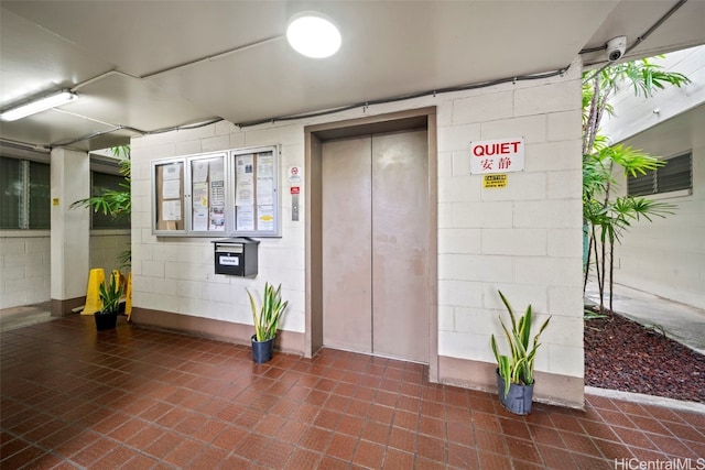 entrance to property featuring elevator