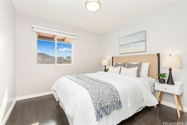 bedroom featuring dark hardwood / wood-style flooring