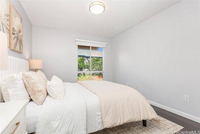 bedroom featuring dark wood-type flooring