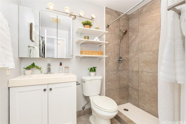 bathroom with vanity, a shower with shower curtain, and toilet