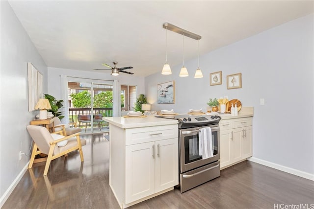 kitchen with kitchen peninsula, decorative light fixtures, white cabinetry, and electric stove