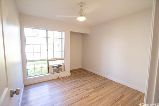 empty room featuring ceiling fan and light hardwood / wood-style floors