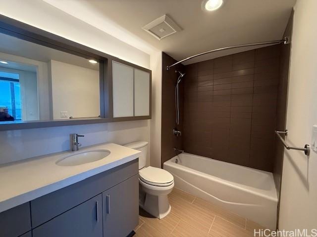 full bathroom with vanity, toilet, and tiled shower / bath