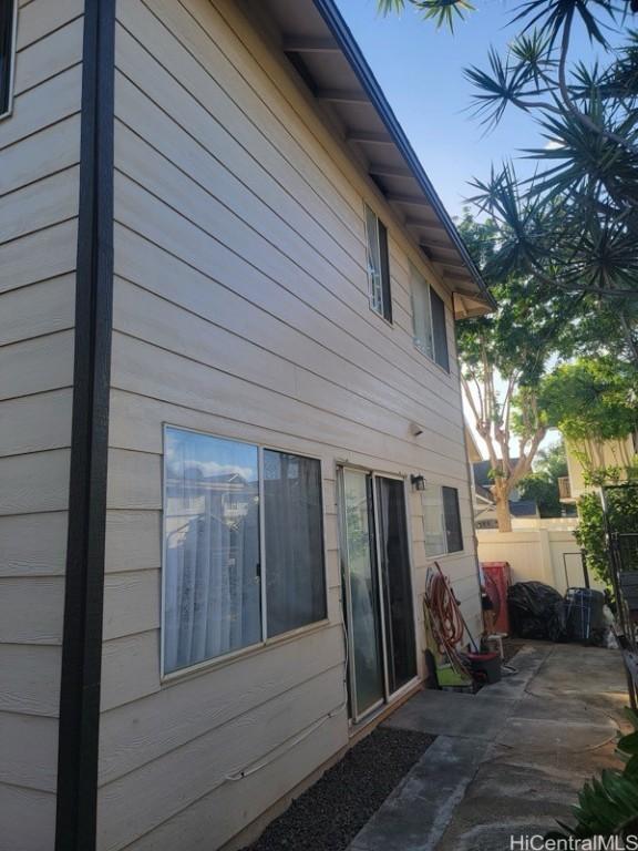 view of side of home with a patio