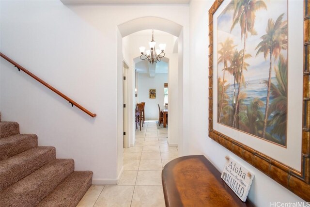 68-1125 N Kaniku Dr Unit 102, Kamuela, HI 96743 - hall featuring light tile patterned floors and an inviting chandelier