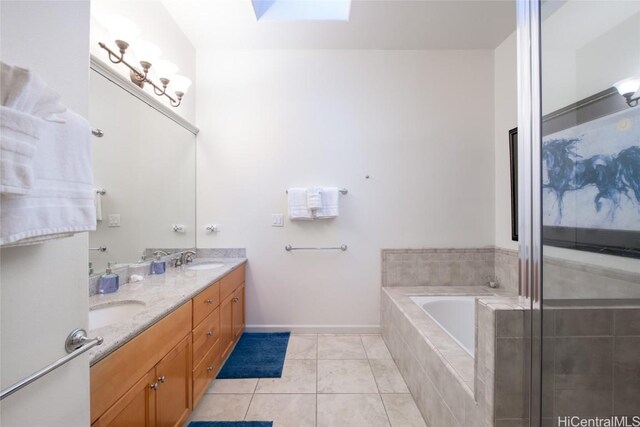 68-1125 N Kaniku Dr Unit 102, Kamuela, HI 96743 - bathroom with tile patterned flooring, vanity, a skylight, and tiled bath