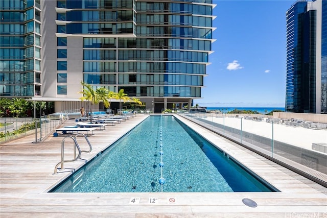 view of pool with a water view