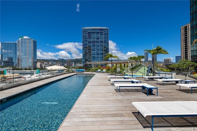 view of swimming pool featuring a deck