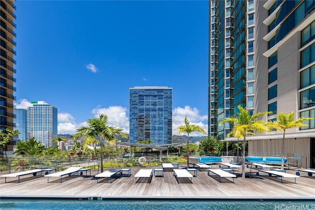 view of swimming pool featuring an outdoor hangout area and a wooden deck