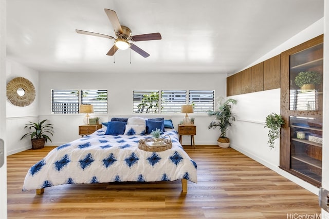 bedroom featuring ceiling fan and light hardwood / wood-style floors