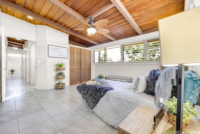 tiled bedroom featuring vaulted ceiling with beams, ceiling fan, and wooden ceiling