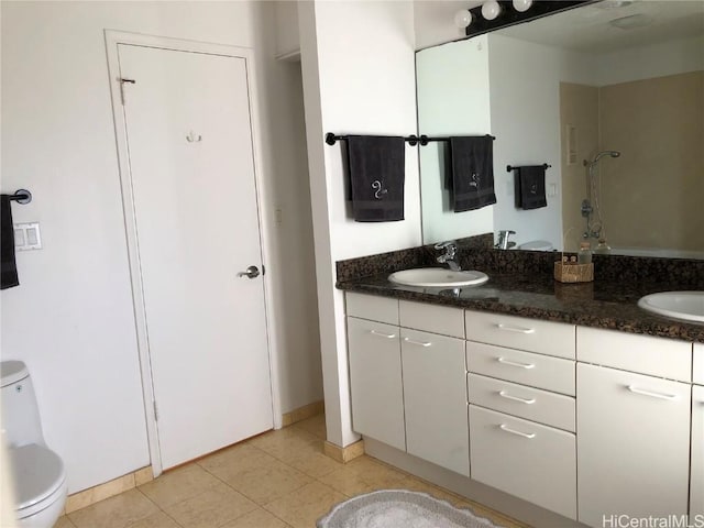 bathroom featuring walk in shower, tile patterned flooring, vanity, and toilet