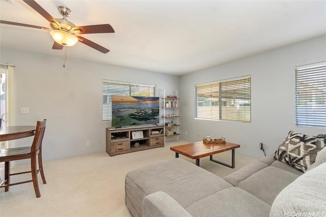 living room with light colored carpet and ceiling fan