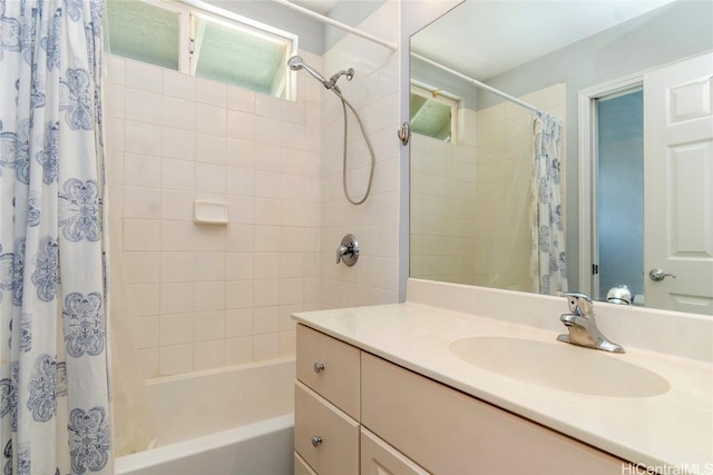 bathroom featuring vanity and shower / bath combo with shower curtain