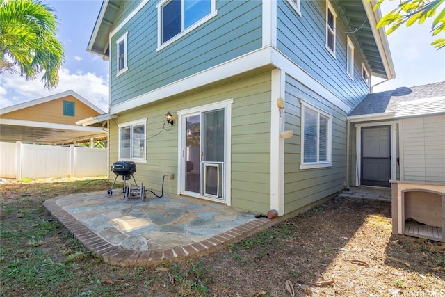 back of property featuring a patio