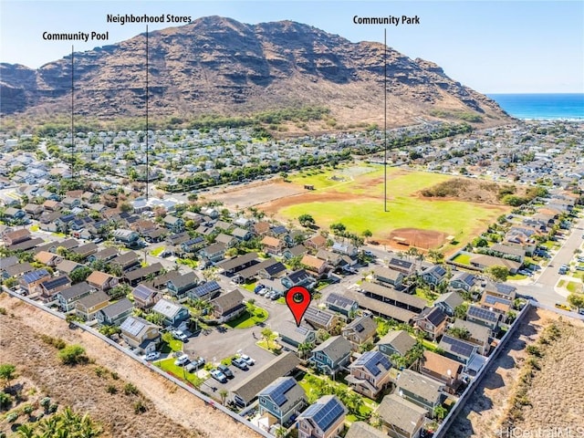 drone / aerial view with a water and mountain view