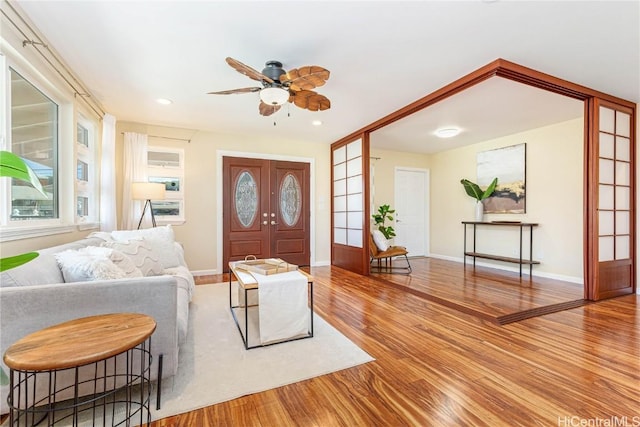 entryway with french doors, light hardwood / wood-style flooring, and ceiling fan