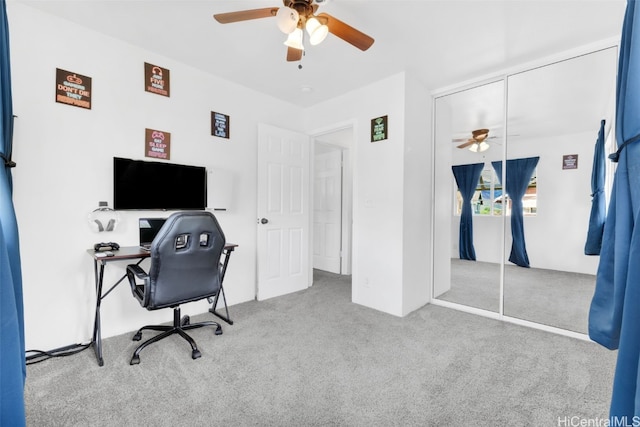 office with ceiling fan and light colored carpet